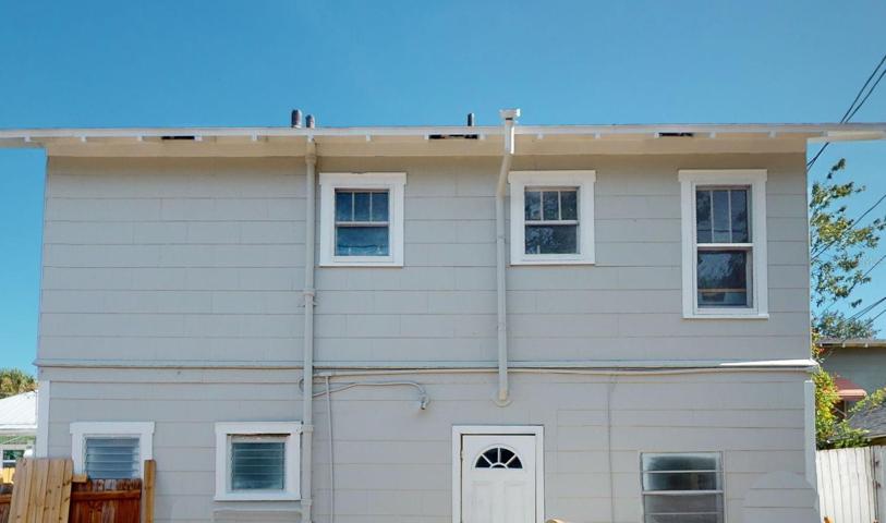 Back of garage apartments from alley