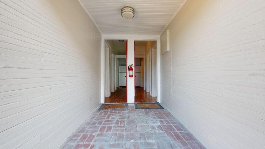 Back entrance to front two apartments.