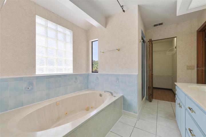 master bath has walk in closet with built-in safe.