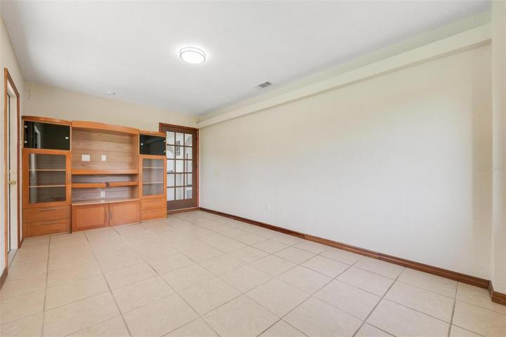 10.5x17.6 office off kitchen with fixed entertainment center