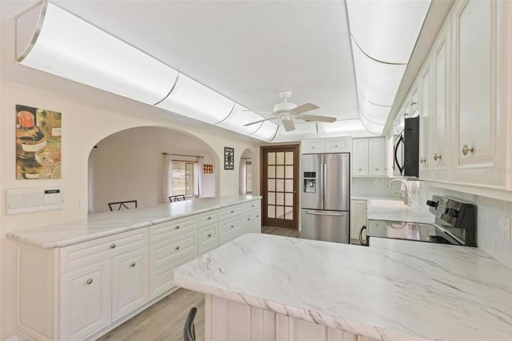 long countertop overlooking dining room/living room.