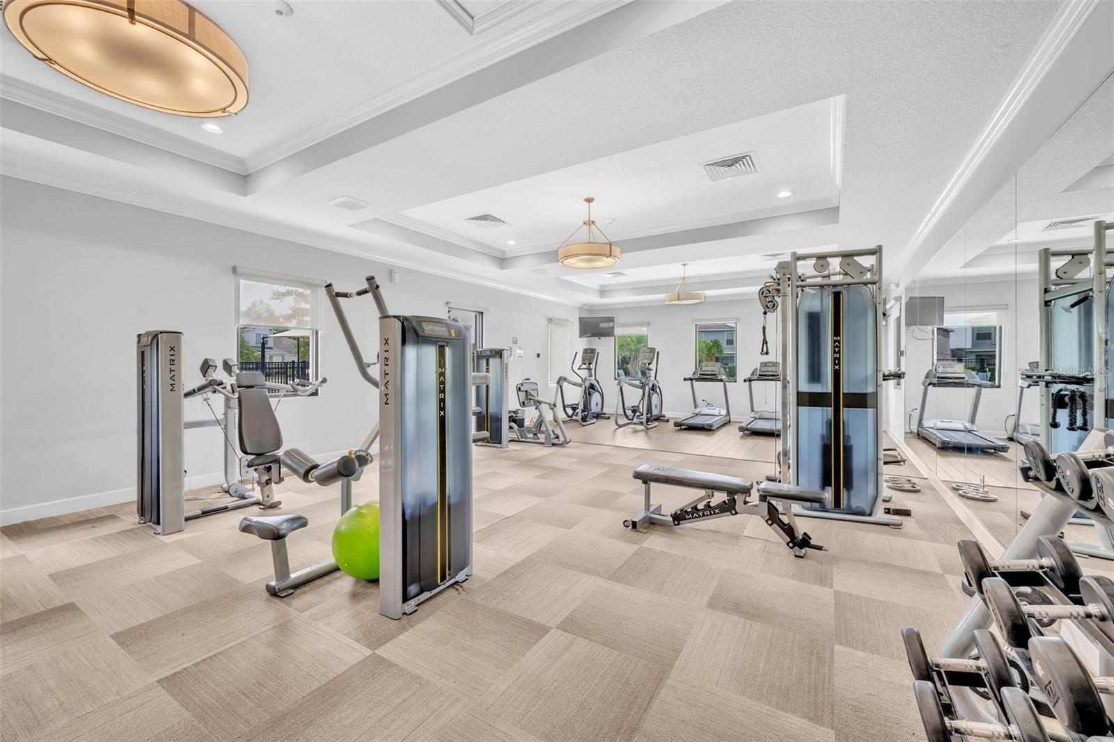 Full-sized gym located in clubhouse