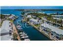 YOUR WATERFRONT PATIO is the Lower Level, 2nd 1 down, in Yellow Building on Right side. Looking S at Skyway Bridge in the Distance