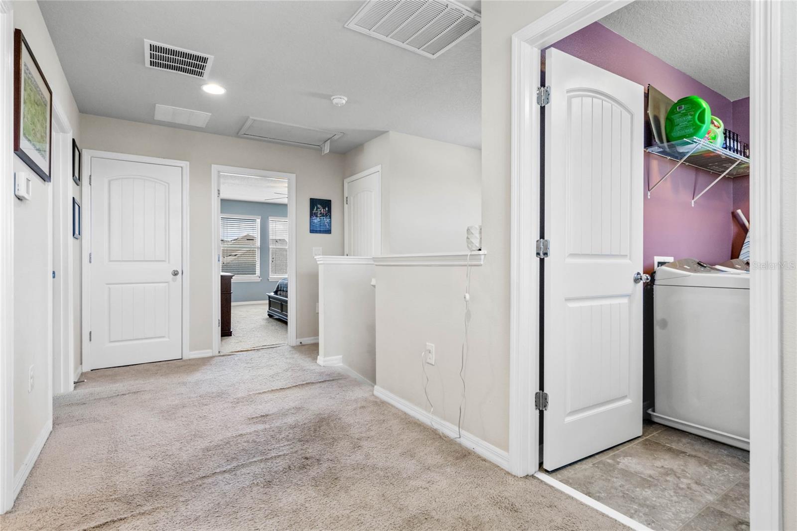 Hall upstairs looking into laundry room