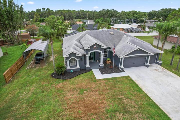 Extra large driveway and covered parking, shed too.