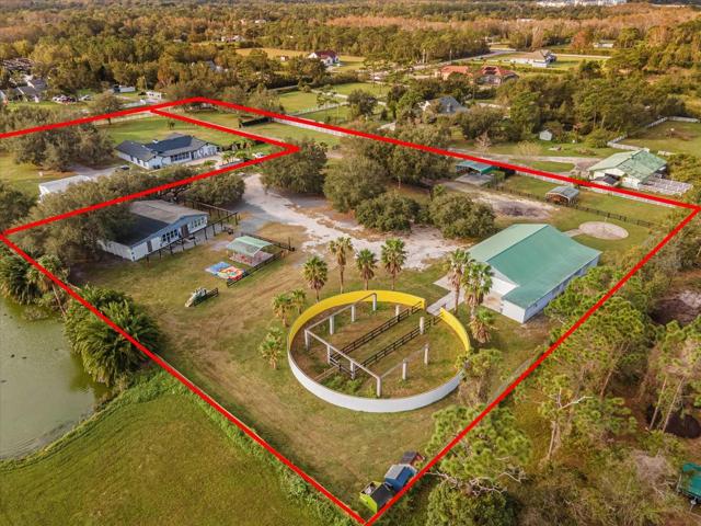 Full property from the back. Pictured here is your new Round pen, Main home, Structure number 2 (game house/in law home) and Structure number 3 (Can use for weddings and event space. Has all hook ups or can be converted into a 3rd home on your new property)