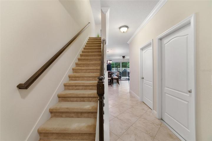 The iron banister on the stairs adds to the elevated feel of this home and guides the way to your bedrooms on the second floor!