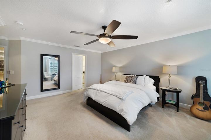 The generous primary suite is a must see, the crown molding continues, there is WALK-IN CLOSET with a CUSTOM CLOSET SYSTEM and your private bath!