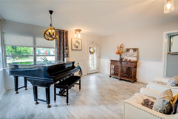 View of the Living Room from the Kitchen and Family Room area of the home