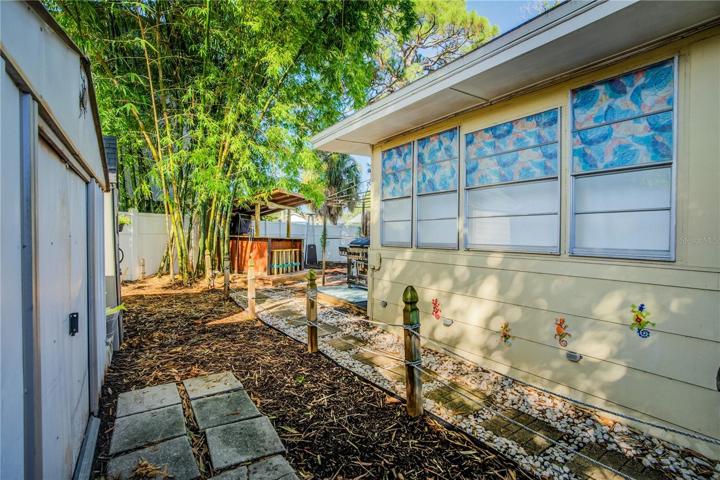 3 Sheds provides storage in the back yard
