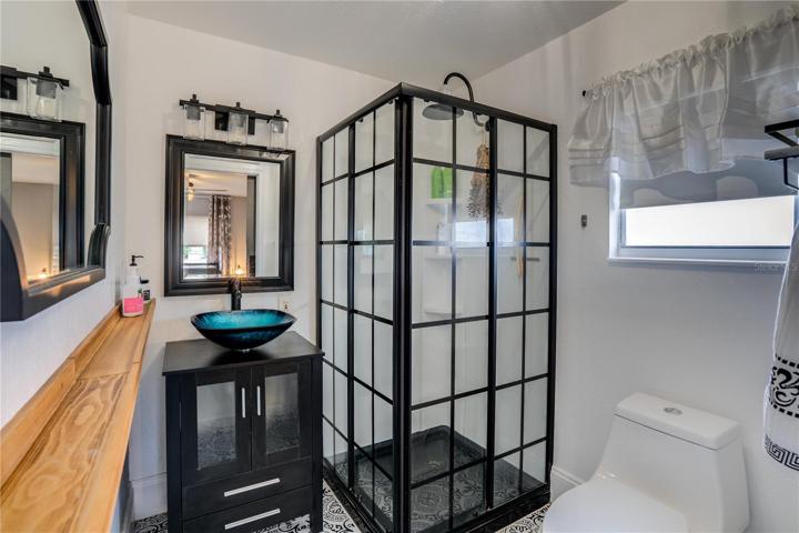 Master Bath with custom vanity and designer sink. Check out the great shower