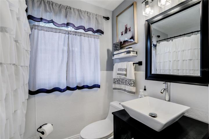 The second Bath features a furniture grade vanity and designer sink