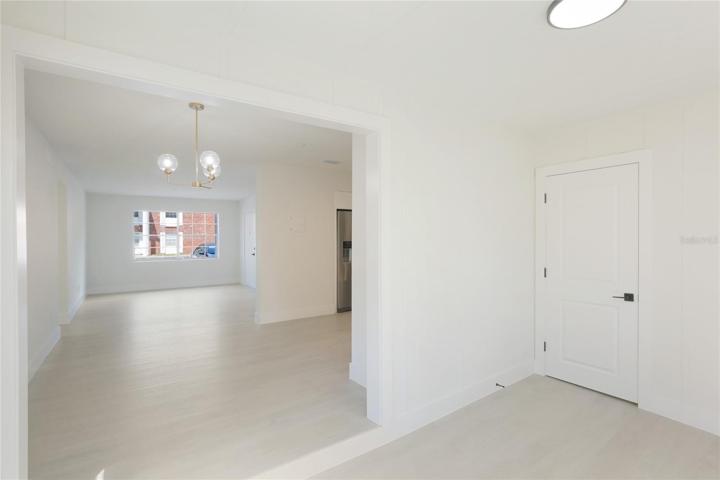 Off the sunroom you will find a laundry closet, a rare find in these condos.
