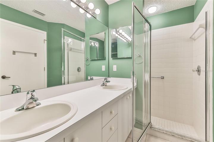 Master Bathroom with Walk in Shower with Bars + Dual Sinks