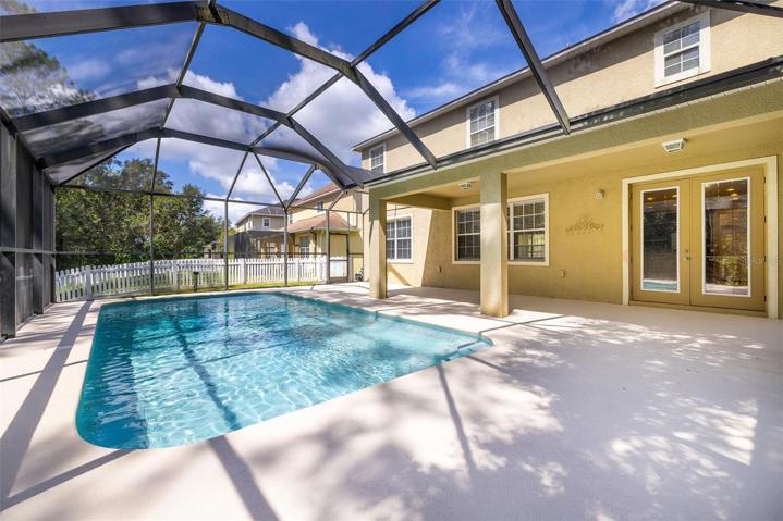 Pool, Lanai, Patio and Fenced Dog-Run with Conservation Wooded-View