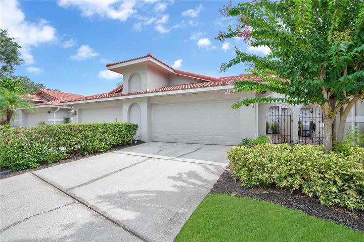 Welcome home to your completely updated and professionally decorated Naples floor plan in the desirable and gated Sandpointe Townhomes