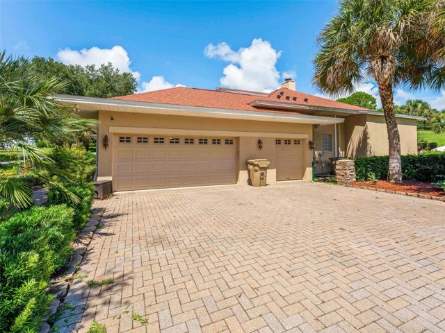 Driveway to garage located at the side of the home