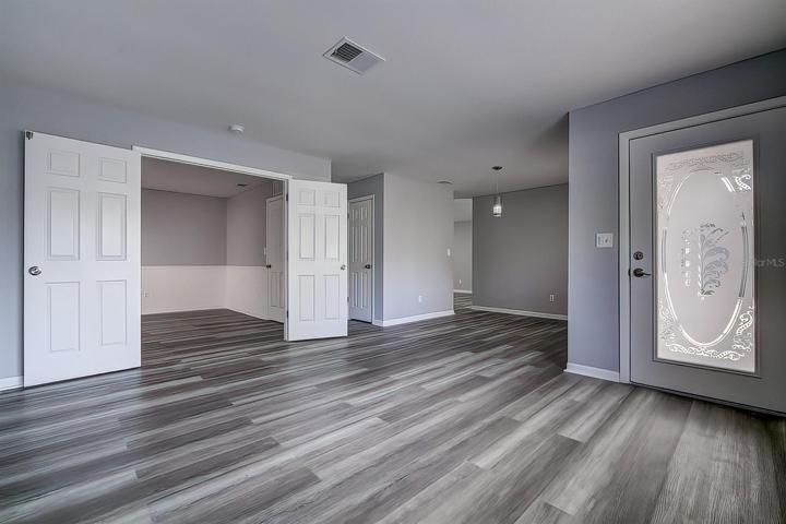 Living room, front entry, dining room, bedroom 3 entry