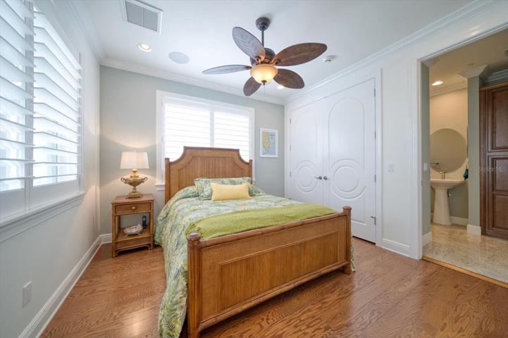 Guest bedroom with ensuite bath on second level.