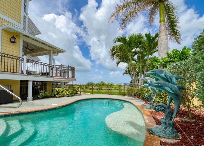 Walk in heated pool with sun shelf, and picturesque Dolphin features