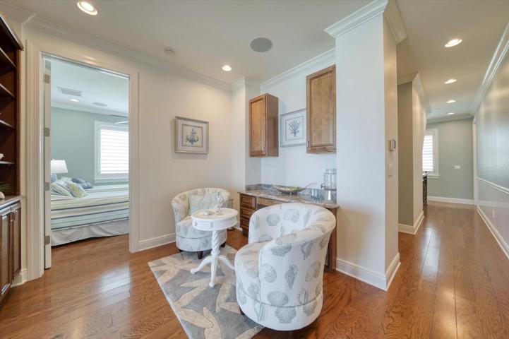 Adjacent to the primary suite, morning bar for quiet moments  is situated in this office area. Additional bedroom may be used for  dressing area for the primary bedroom use.