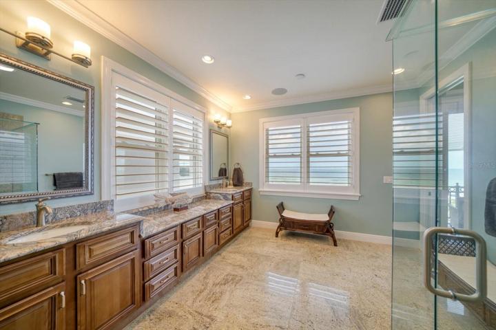 Primary bath area has lots of storage and double vanities.