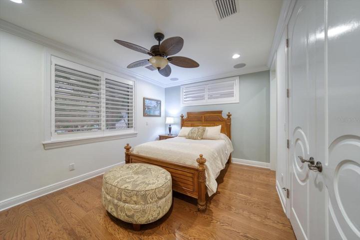 Guest bedroom on main living level with large closet and bathroom.