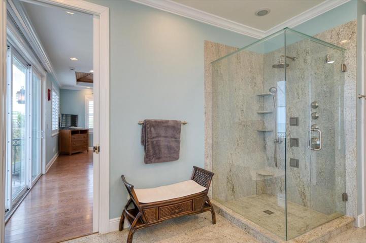 Primary suite shower with multiple heads.