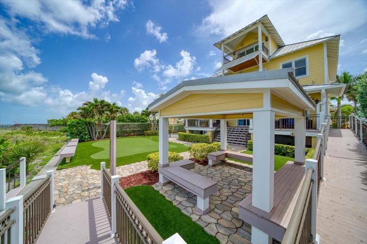 Outdoor gazebo area and ramp from front entry.