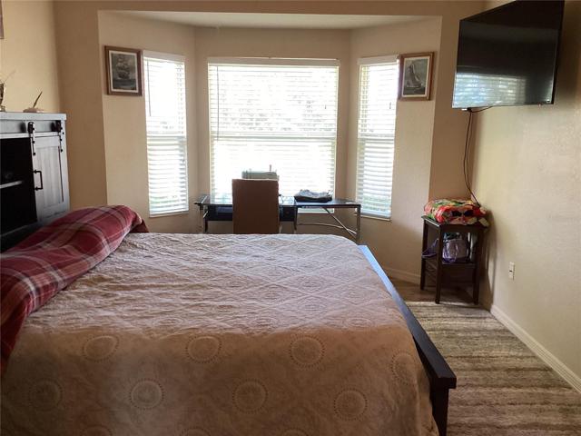 master bedroom with bay window