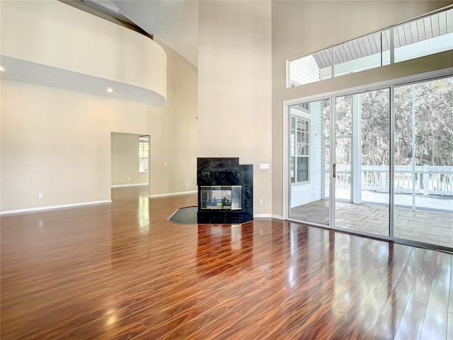 Living room opens to deck and wraps to dining room