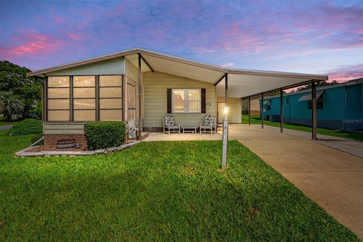 FRONT EXTERIOR @ DUSK - 731 Orchid Street, Lady Lake, FL 2159 - Virtually enhanced