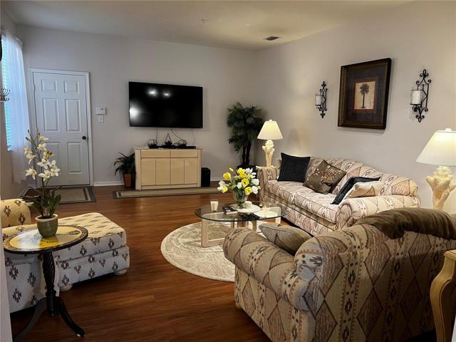 Living room with view to the door that leads to the garage