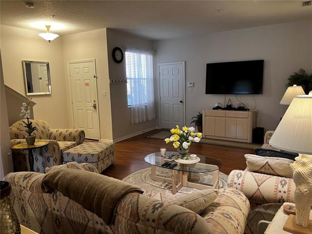 Living Room with view to front door and entrance to garage