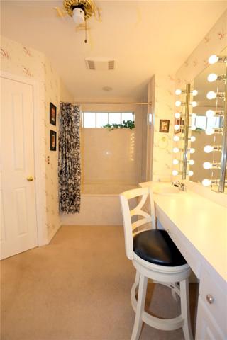 Master bath. The door is to one of two walk in closets.