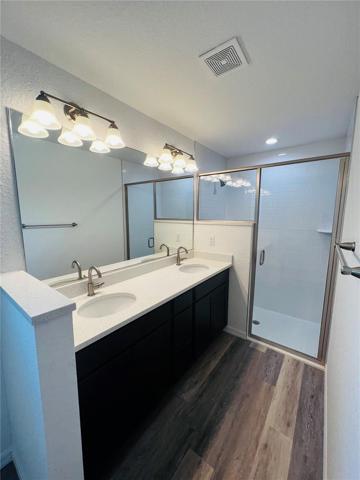 Primary En Suite with 2 sinks, Quartz Counters and walk in shower