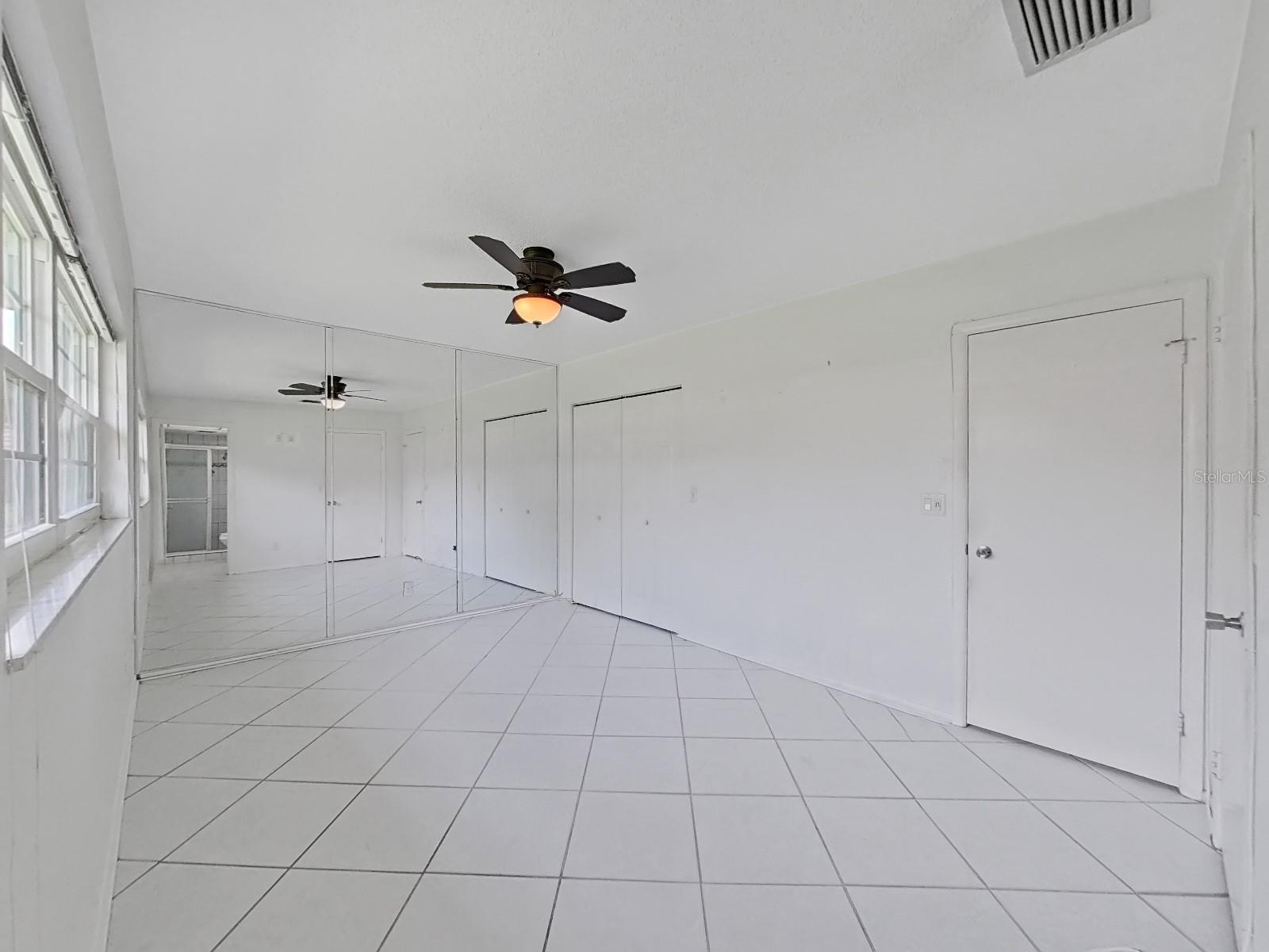 Master Bedroom with two closets, one is a walk in closet