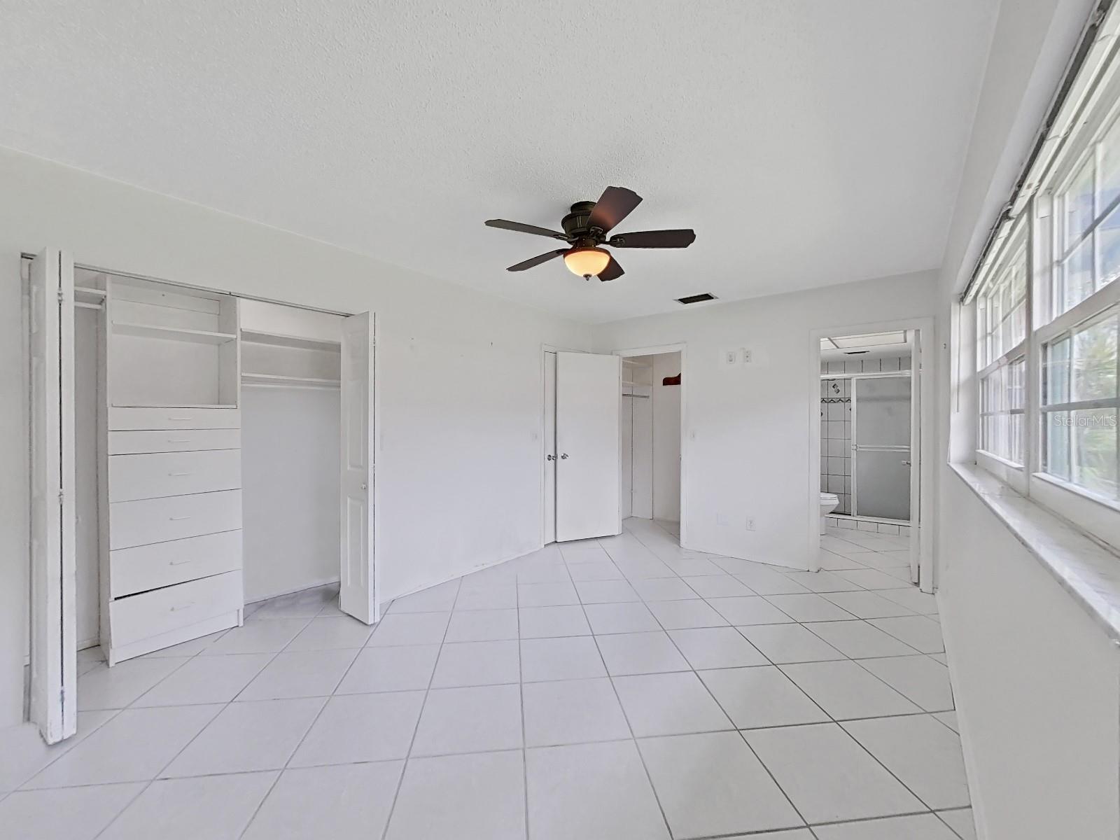 Master Bedroom with two closets, one is a walk in closet