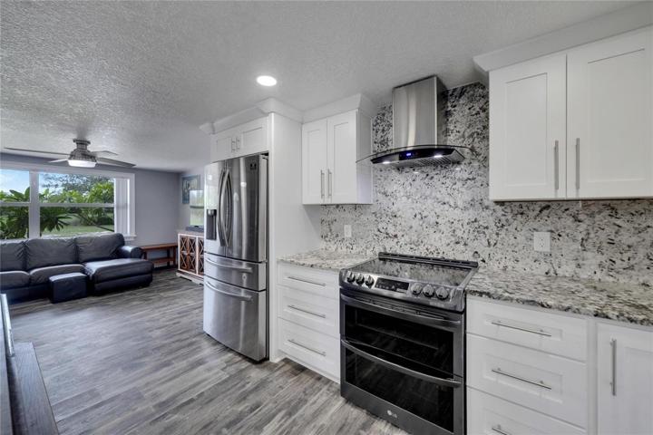 New Kitchen with Granite Countertops and backsplash