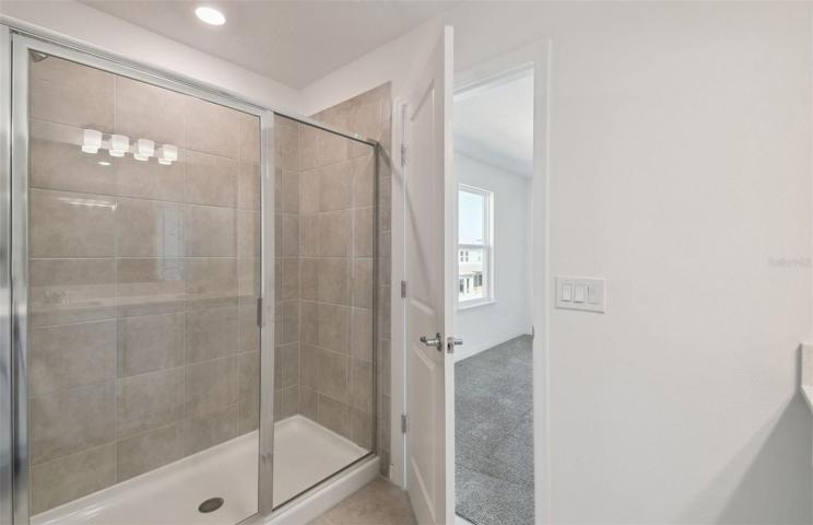 Owner's Walk-In Shower with Glass Enclosure