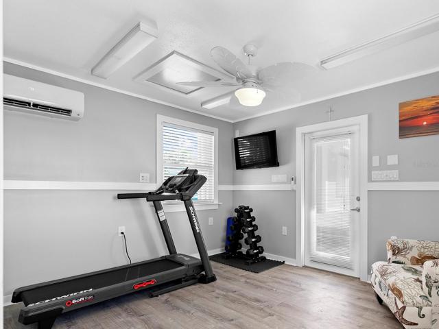 The gueest house bonus room currently set up as a personal workout space.