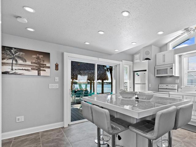 Sliding doors provide ease of serving to the expansive deck outside.