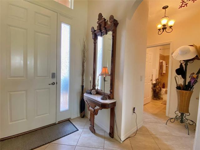 Front Door and Hall to Guest Bath and Bedroom