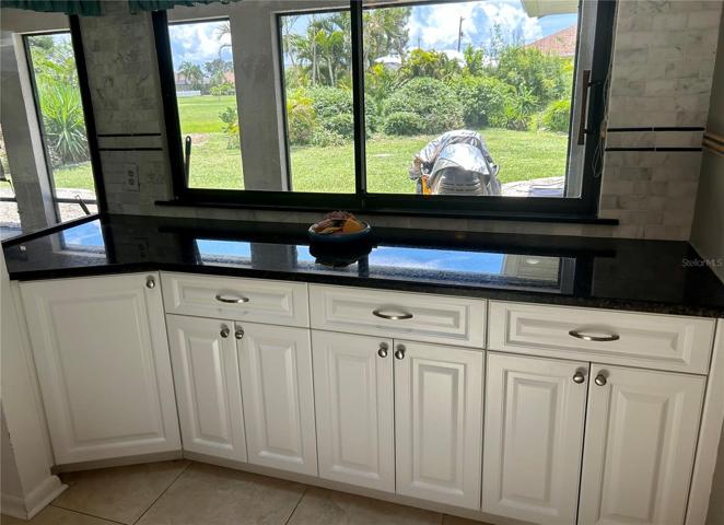 More counter space, and storage. A coffee bar perhaps? Cabinet on the left has a lazy susan