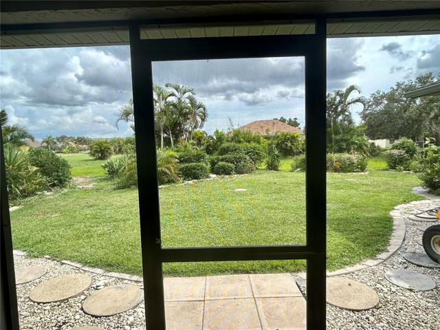 Lanai screen door to the backyard