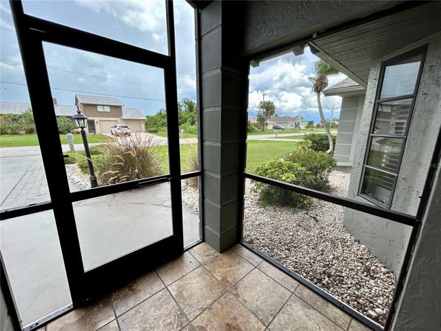 View looking from front door to the front yard and driveway