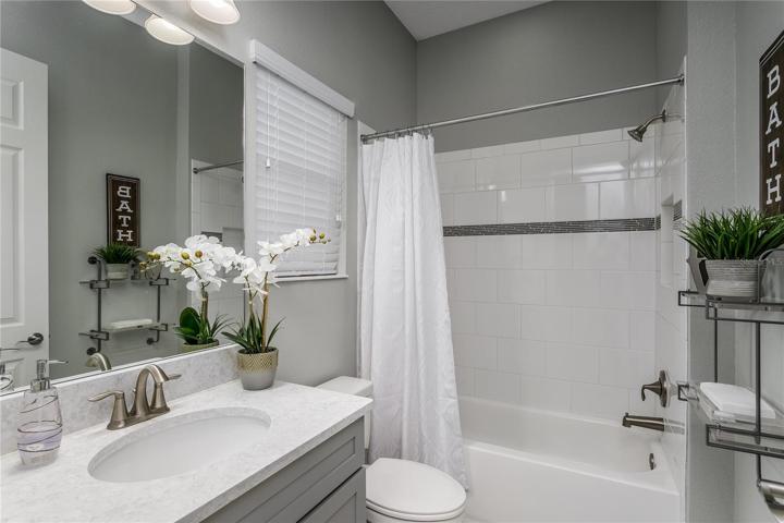 Full bath adjacent to downstairs guest/in-law bedroom