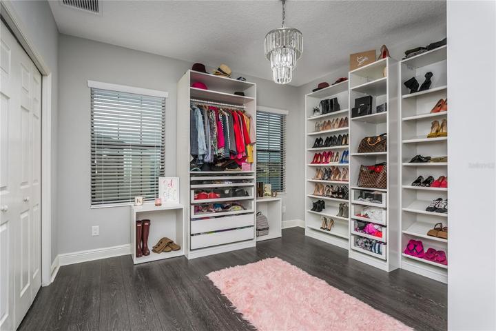 3rd bedroom with custom closet system (2018-$2k).  Can also use as playroom!