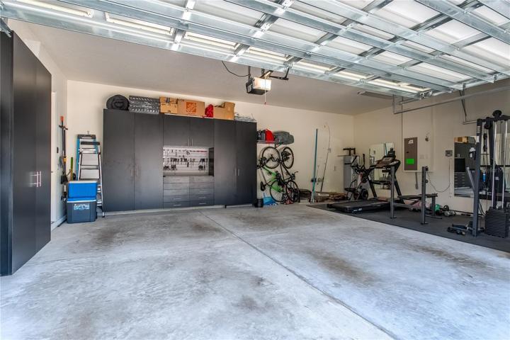 Oversized 3-car garage with built-in storage system (conveys!).