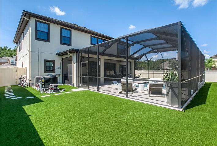 Large side yard for lawn games (cornhole) or play area